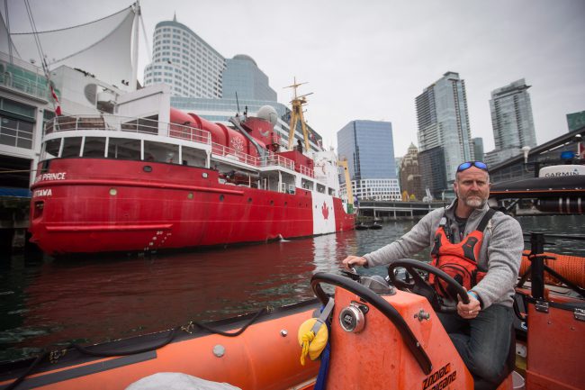 Expedition manager Scott McDougall, of Chelsea, Que., pilots a zodiac boat on the harbour where the Polar Prince ship was moored in Vancouver, B.C., October 23, 2017. 


