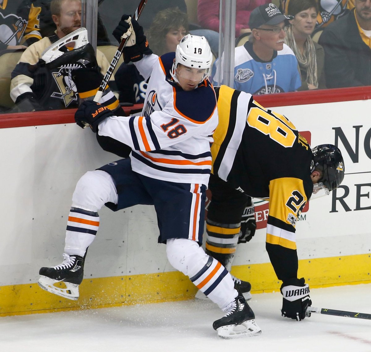Edmonton Oilers' Ryan Strome (18) collides with Pittsburgh Penguins' Ian Cole (28) in the first period of an NHL hockey game in Pittsburgh, Tuesday, Oct. 24, 2017. (AP Photo/Gene J. Puskar).