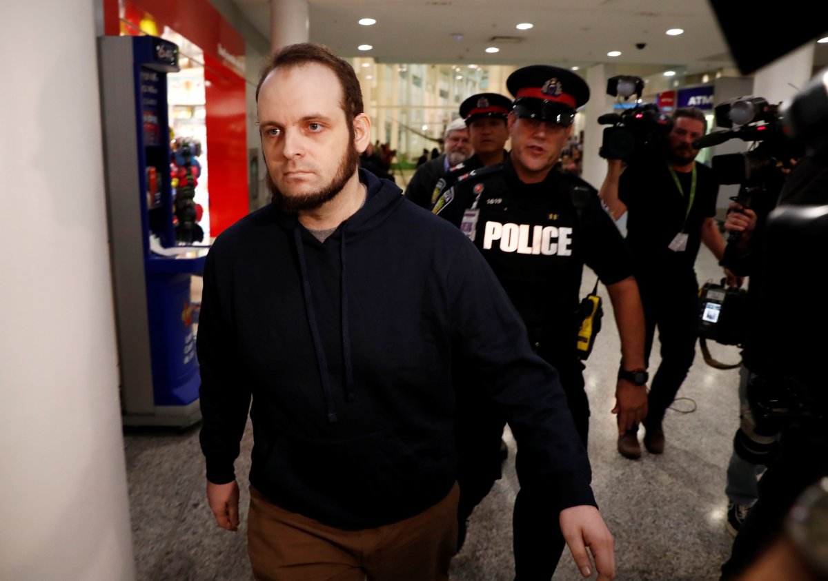 Joshua Boyle walks through the airport on Oct. 13, 2017, after arriving with his wife and three children at Toronto Pearson International Airport, nearly five years after he and his wife were abducted in Afghanistan in 2012 by the Taliban-allied Haqqani network.