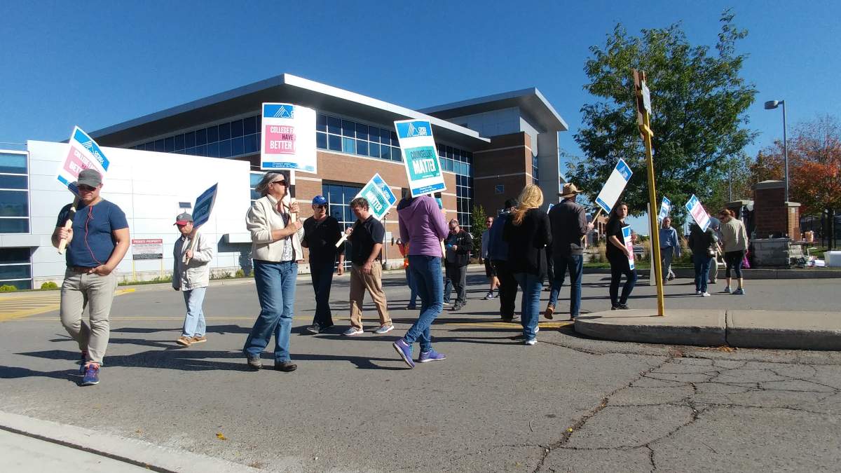 Striking teachers, counsellors, and librarians walk the picket line at Fanshawe College.