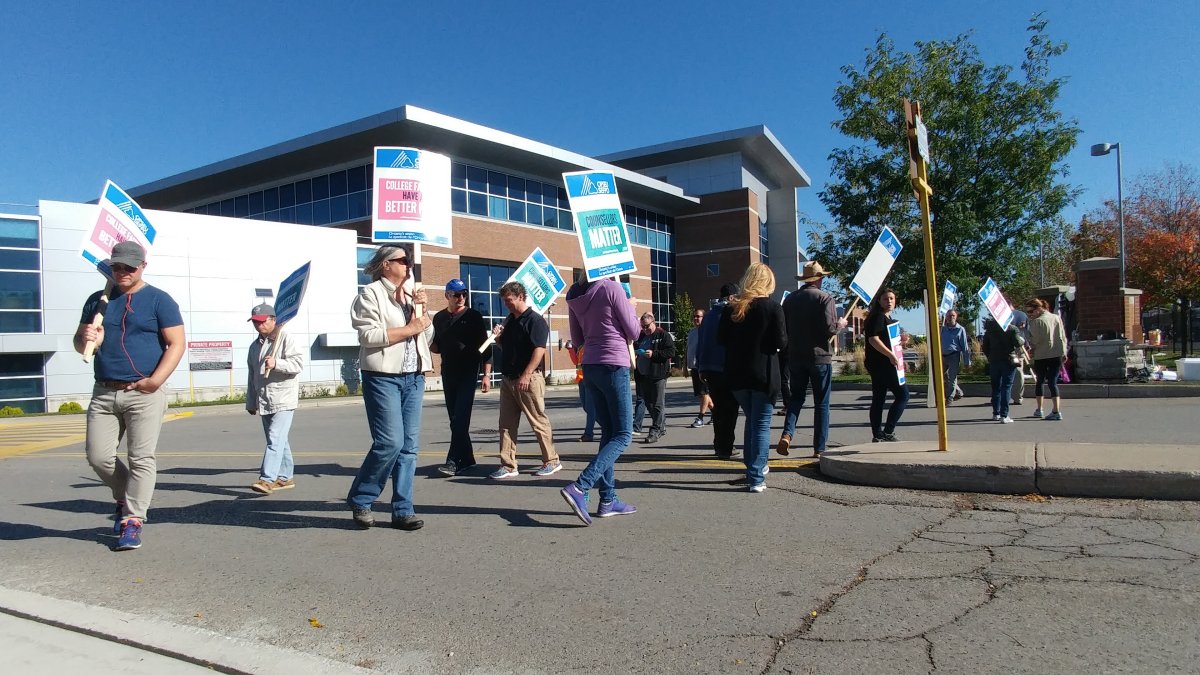 Striking teachers, counsellors, and librarians walk the picket line at Fanshawe College on Oct. 18, 2017.