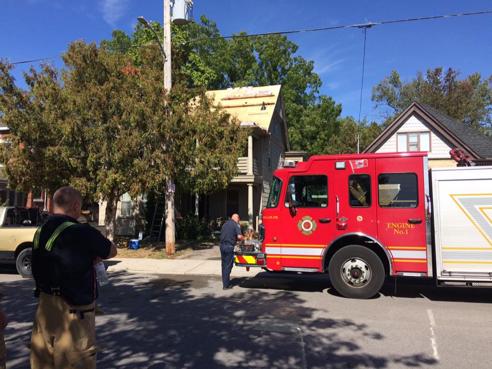 Firefighters outside a Briscoe St. house in London, where a roofer's torch resulted in a fire. Oct. 2, 2017.