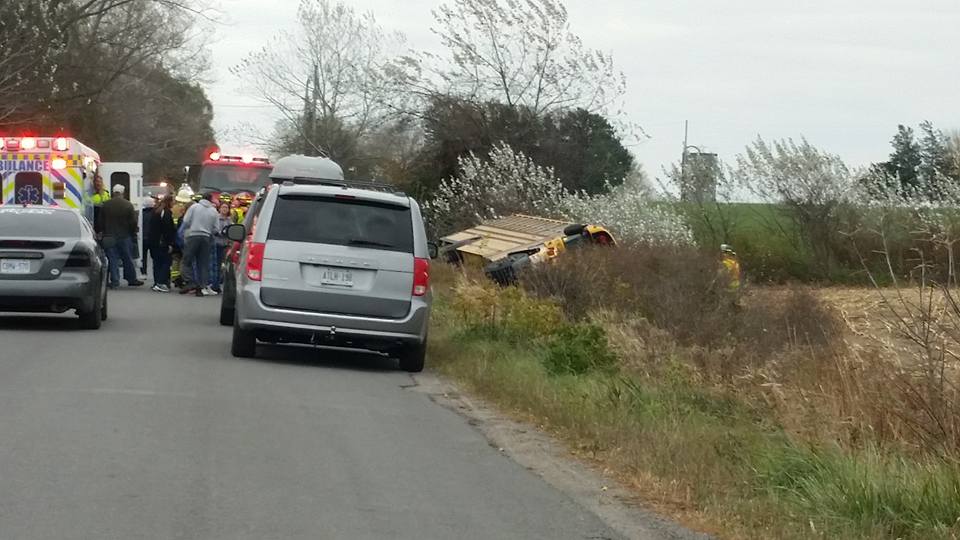 An elderly school bus driver is facing charges after crashing into a ditch in Prince Edward County, Ont. on Monday.