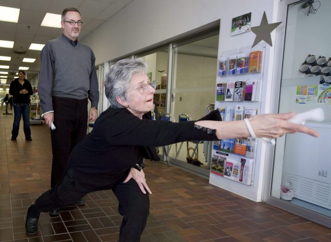 Irene Verner, right, shows good form while bowling on the Nintendo Wii with researcher Dr. James Watzke at the York West Active Living Centre in Toronto, November 13, 2009. 