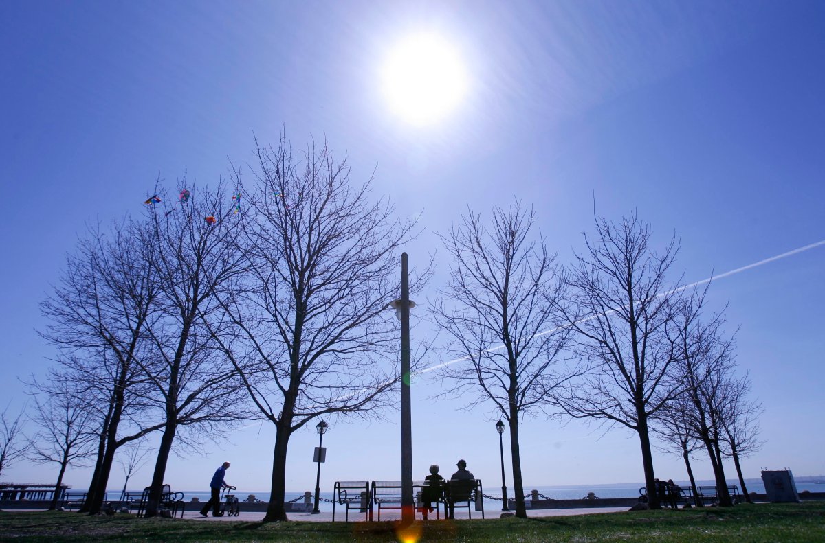 People enjoy a beautiful morning at Spencer Smith Park on the shores of Lake Ontario, in Burlington in a file photo. 