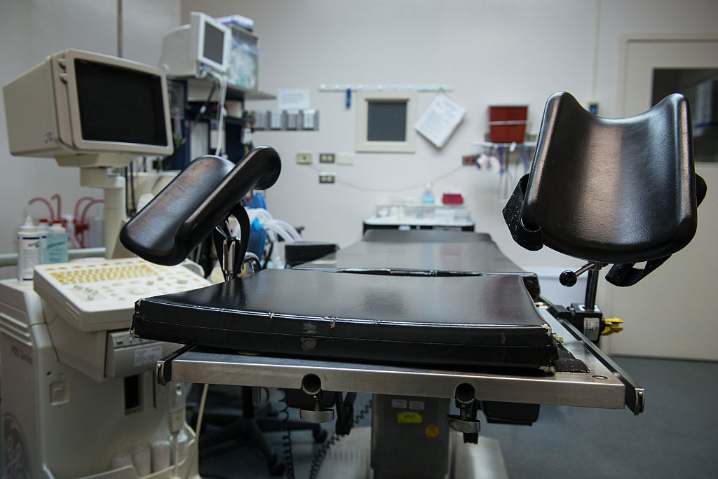 An exam table stands in an operating room at an abortion clinic.