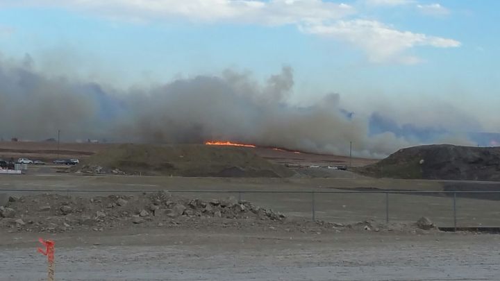 Smoke and flames from a fire in Airdrie seen on Oct. 17, 2017.