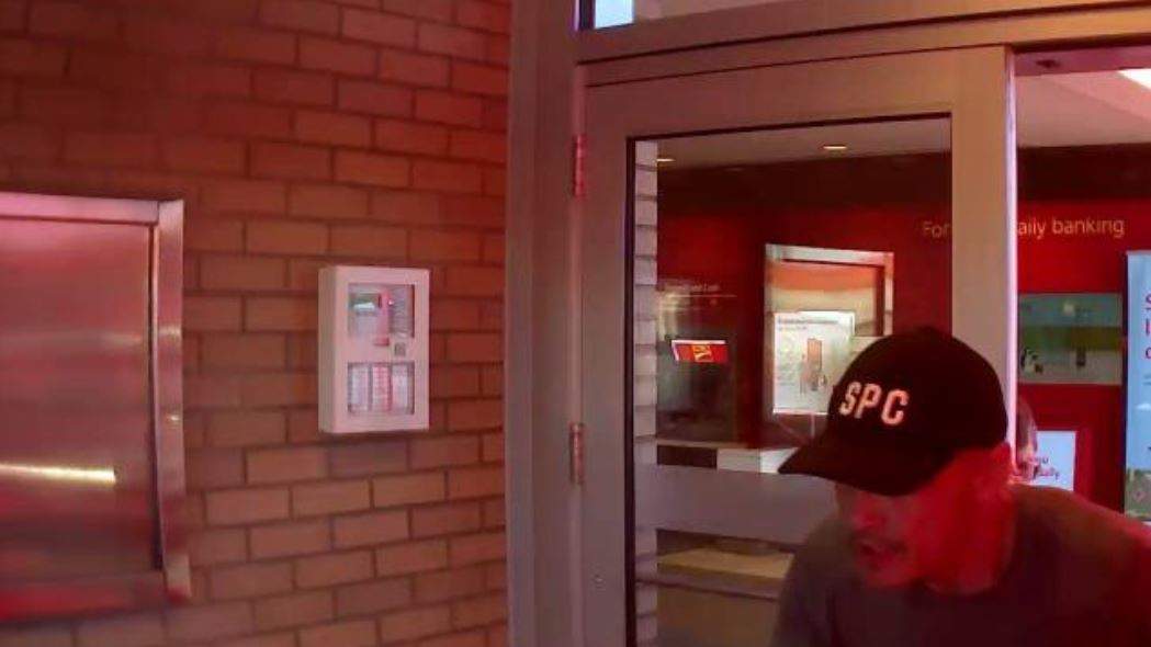 The suspect is described as between 30 and 40 years old, and was wearing a hat with the letters "SPC.".