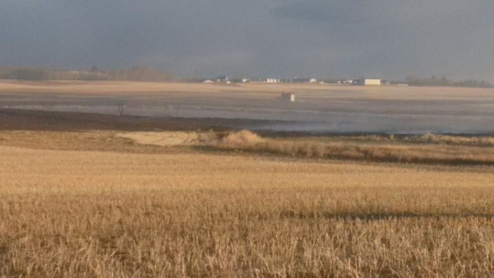 RCMP say a grass fire northeast of Calgary was ignited due to a cigarette butt on Oct. 29, 2017.