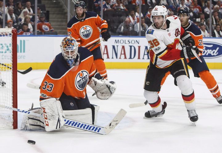Calgary Flames’ Troy Brouwer (36) is stopped by Edmonton Oilers’ goalie Cam Talbot (33) during third period NHL action in Edmonton, Alta., on Wednesday October 4, 2017.