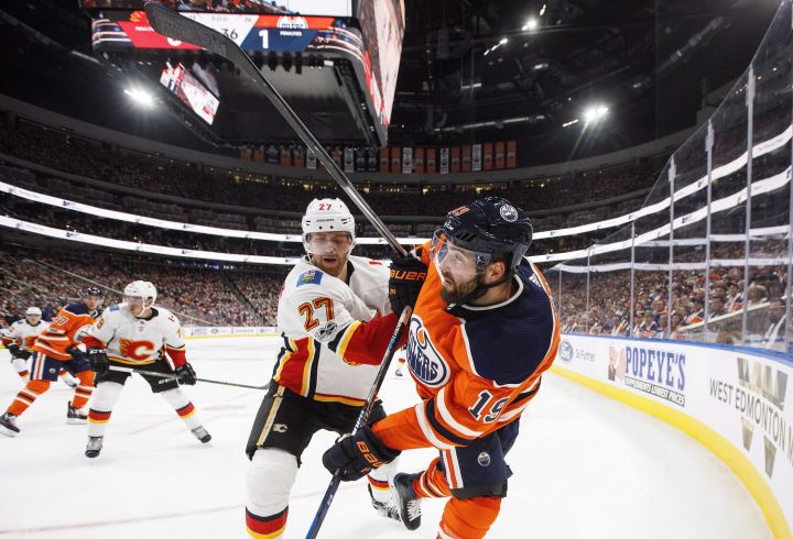 Calgary Flames’ Troy Brouwer (36) chases Edmonton Oilers’ Connor McDavid (97) during second period NHL action in Edmonton, Alta., on Wednesday October 4, 2017.