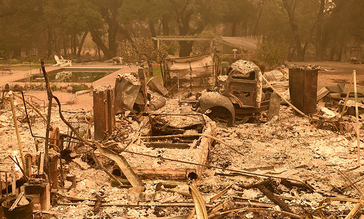A burned home smolders in Glen Ellen, California on October 9, 2017.