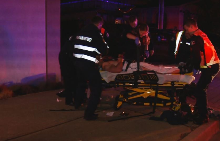 Paramedics tend to the victim of a stabbing at a house party in Abbotsford Saturday night.