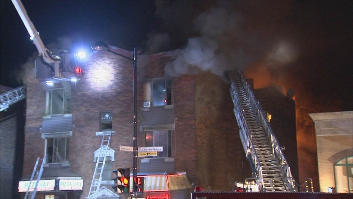Firefighters respond after blaze tears through three-storey building in Côte-des-Neiges. Sunday, Oct. 1, 2017.