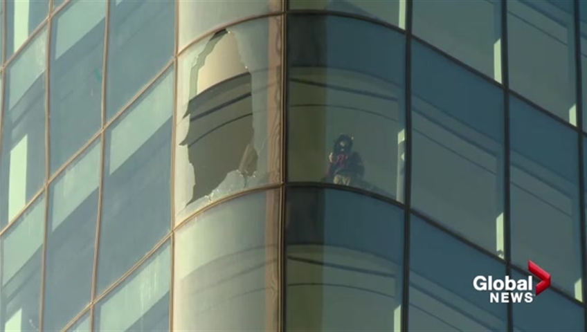 A broken window is seen in Brookfield Place in downtown Calgary on Monday, Oct. 30. 