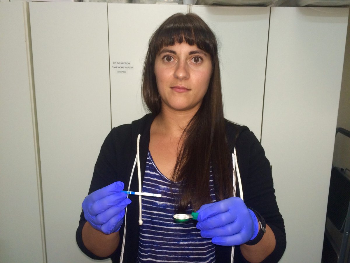 Vancouver Coastal Health clinical coordinator Marjory Ditmars demonstrates the test strips available at Insite.