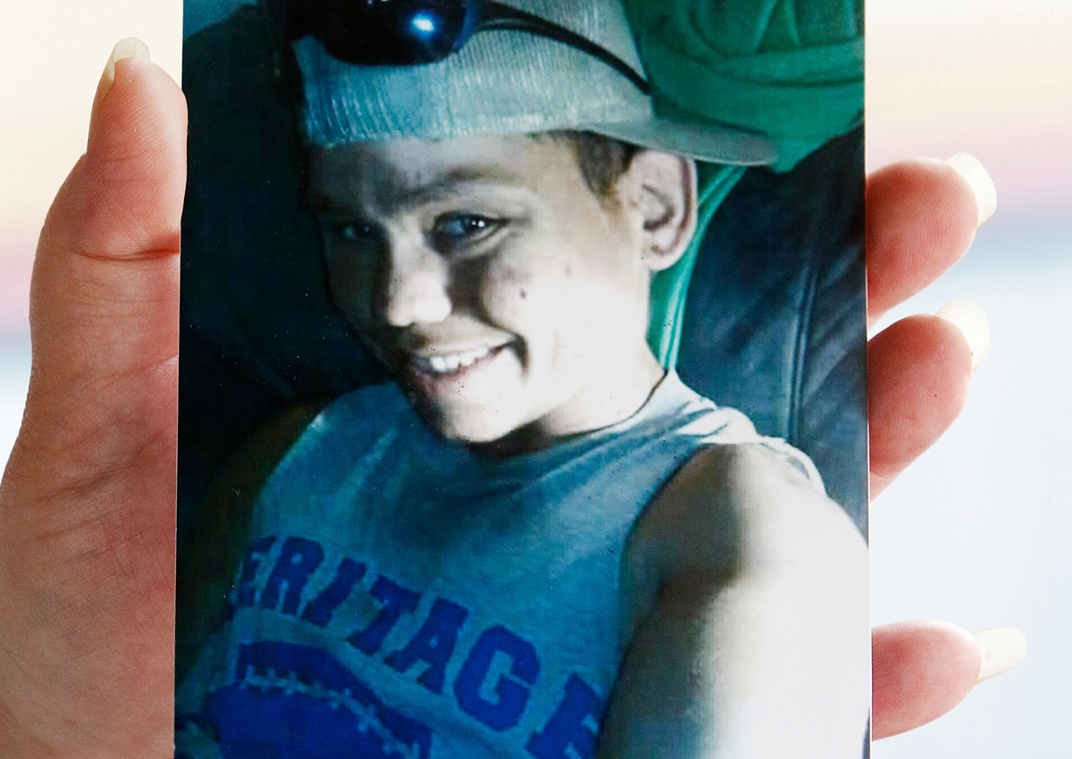 Angie Saunders holds a photo of her son Cody Dale Saunders in Townsend, Tennessee, U.S. July 21, 2017.