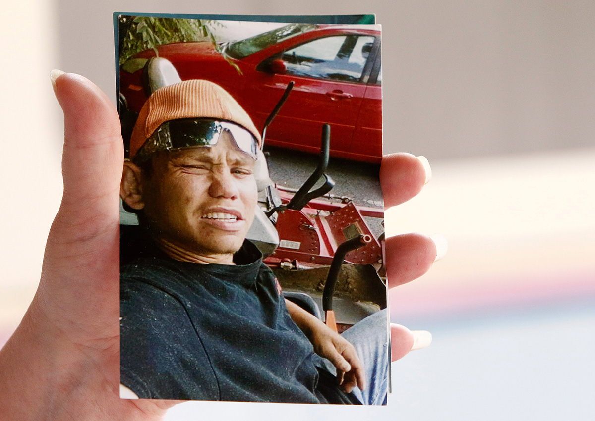 Angie Saunders holds a photo of her son Cody Dale Saunders in Townsend, Tennessee, U.S. July 21, 2017.