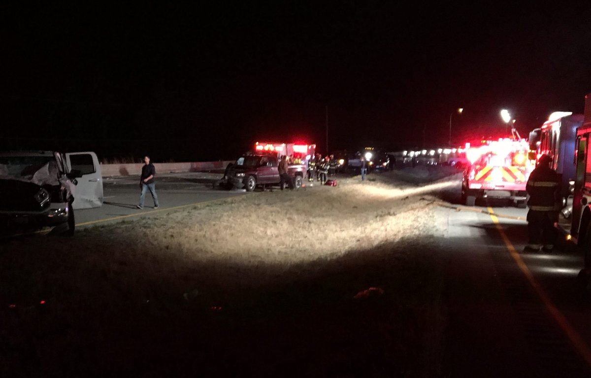 Emergency crews attend to a large accident scene outside of Peachland on Highway 97C Friday night. 
