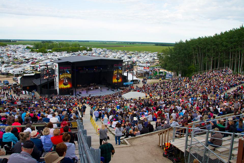 Festival-goers take in the sights and sounds of Countryfest in this file photo.
