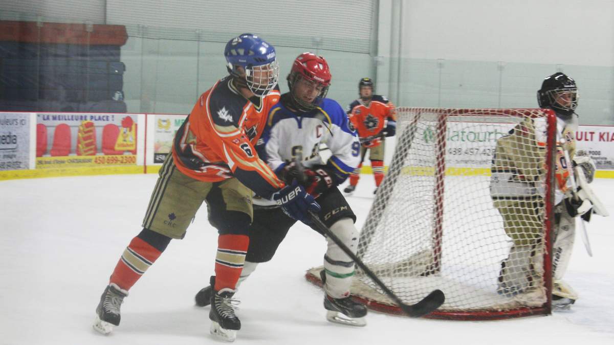 HSB hockey player Patrick Desautels forechecks a Boston Hockey Club defenceman during an exhibition game.