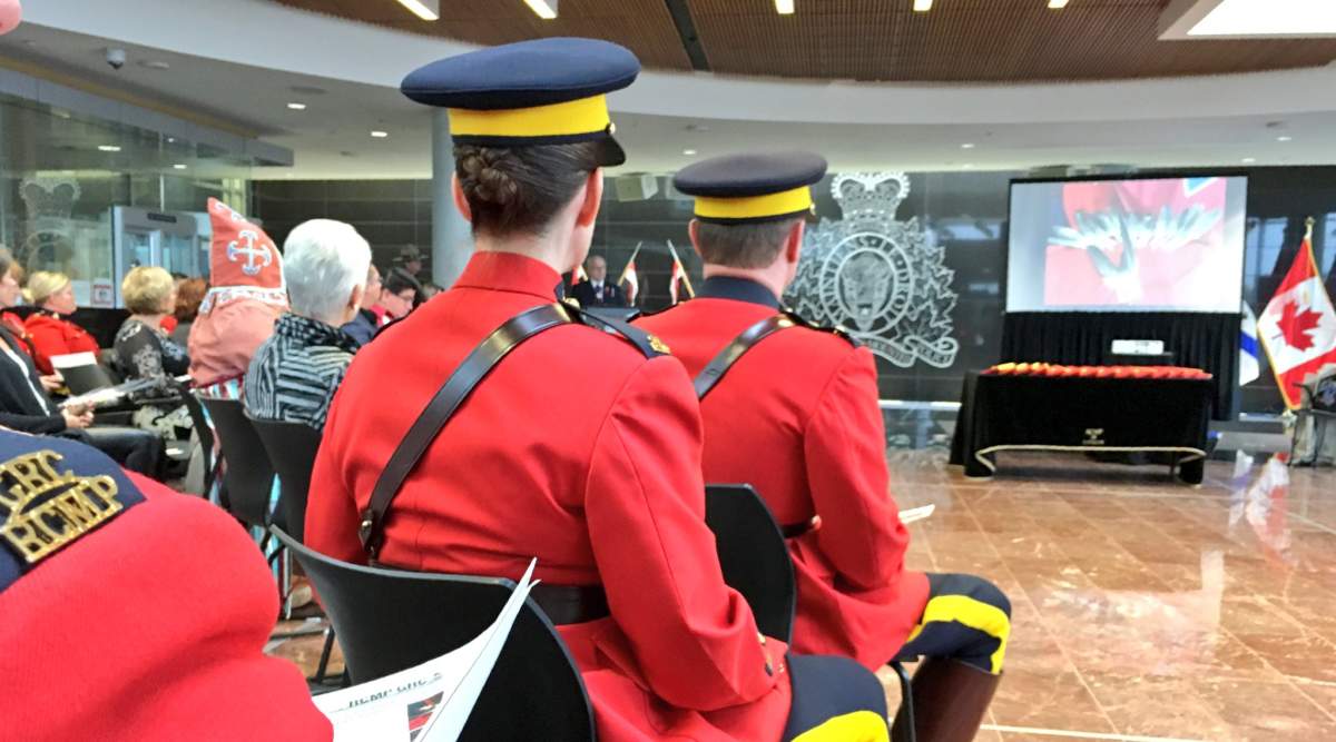 RCMP officers await the presentation of eagle feathers in Halifax, N.S. on Oct. 30.