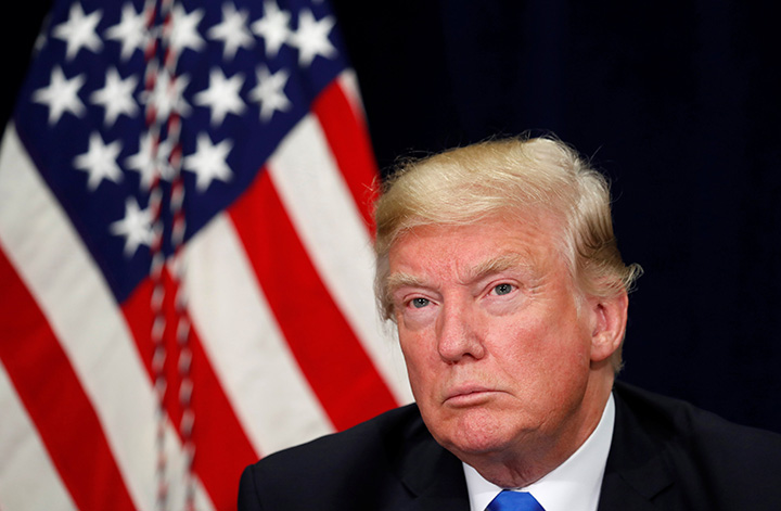 U.S. President Donald Trump listens during a briefing in Dallas, Texas, October 25, 2017. 