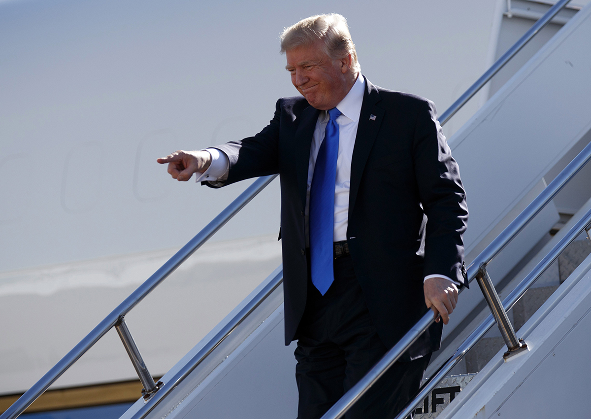 Donald Trump walks down the steps of Air Force One after landing at Dallas Love Field airport, Wednesday, Oct. 25, 2017, in Dallas. 