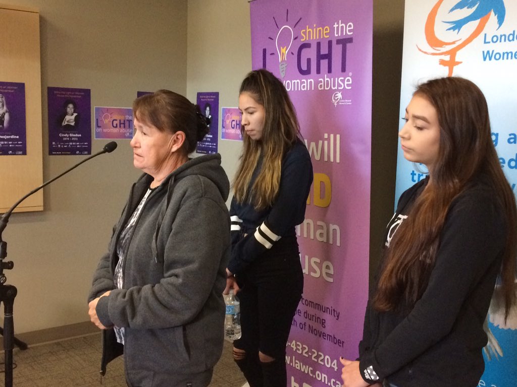 Donna McLeod speaks of her daughter, Cindy Gladue, during the Shine the Light kick-off Friday morning. Her granddaughters, Brandy (centre), and Cheyanne (right), stand behind her.
