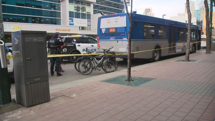 Police are looking for a pair of suspects after two people were taken to hospital after being stabbed on a city bus in downtown Edmonton Monday afternoon.