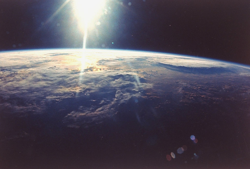 View of sunlight over Earth taken from space shuttle Discovery VIII mission. 