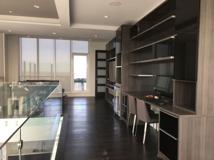 This two-storey penthouse in Edmonton’s Ultima Tower is on the market for $3.13 million and comes with a Bentley.