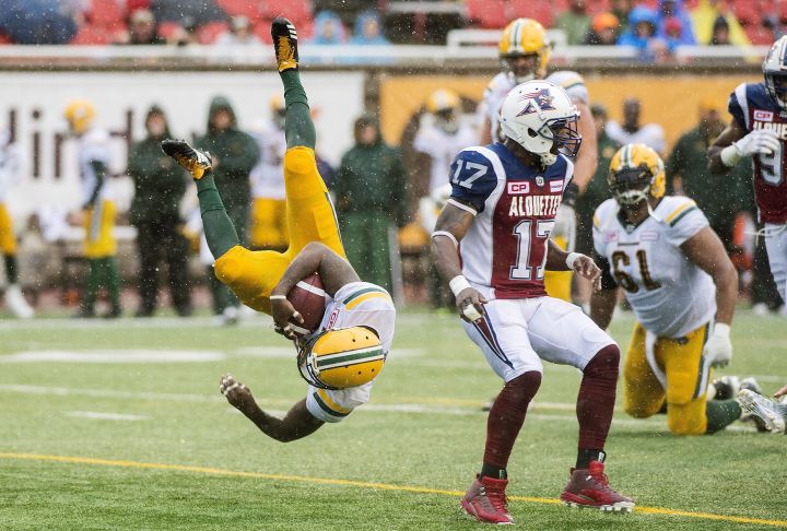 Edmonton Eskimos' C.J. Gable dives in for a touchdown as Montreal Alouettes Brandon Stewart (17) looks on during first half CFL football action in Montreal, Monday, October 9, 2017. 