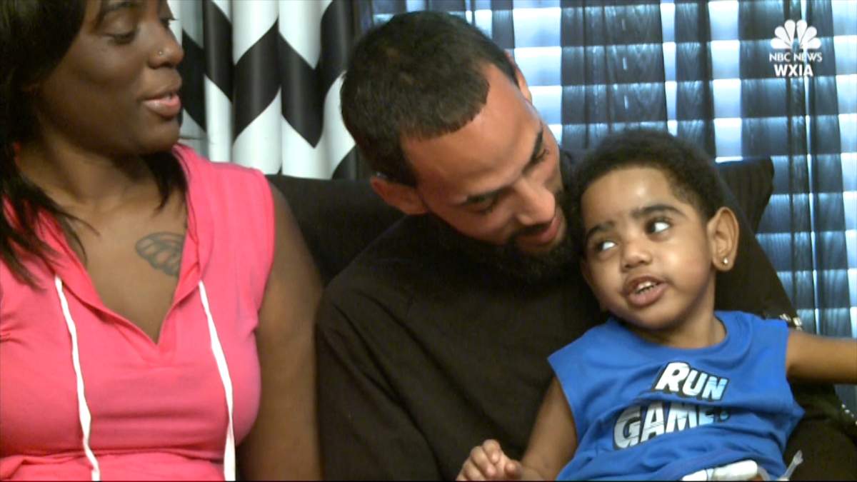 A.J. Burgess, 2, with his parents.