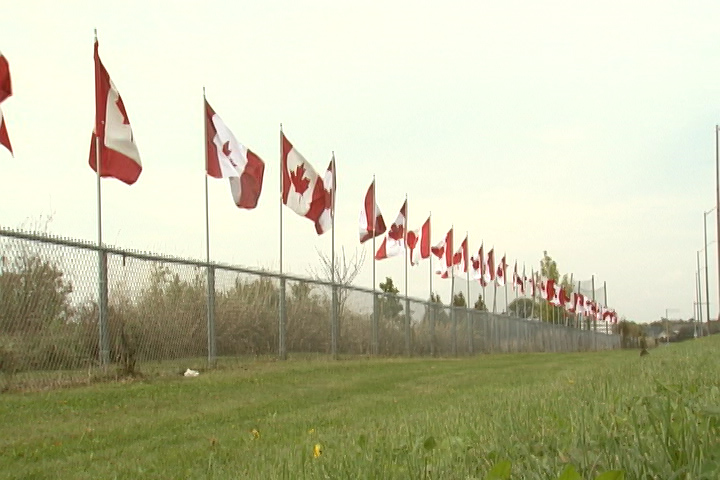 128 Flags of Remembrance raised in Kingston to honour Canadian soldiers ...