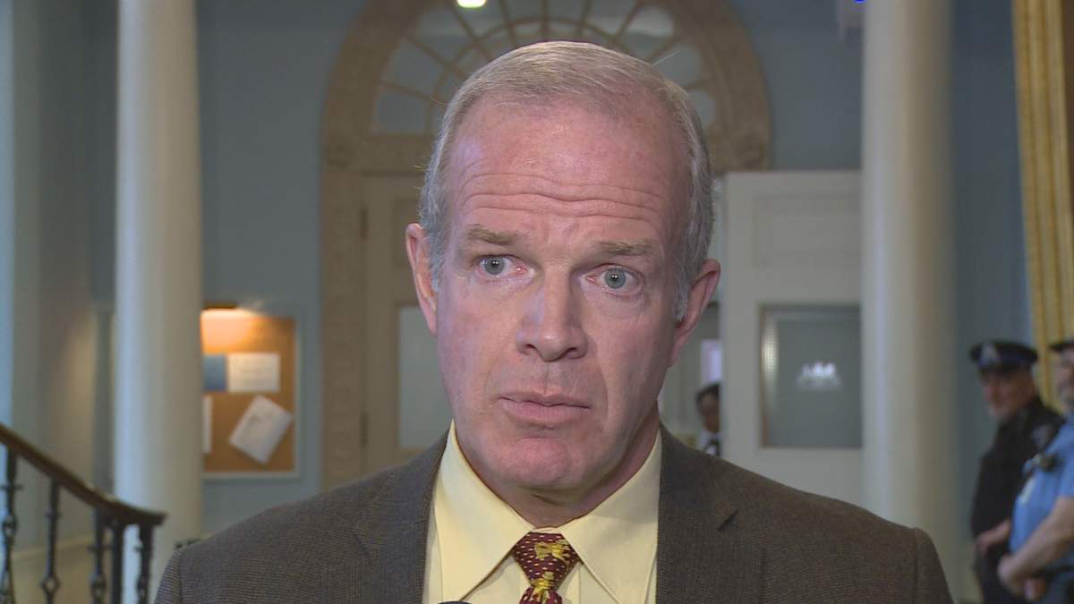 Nova Scotia Justice Minister Mark Furey speaks with a reporter on Oct. 17, 2017.