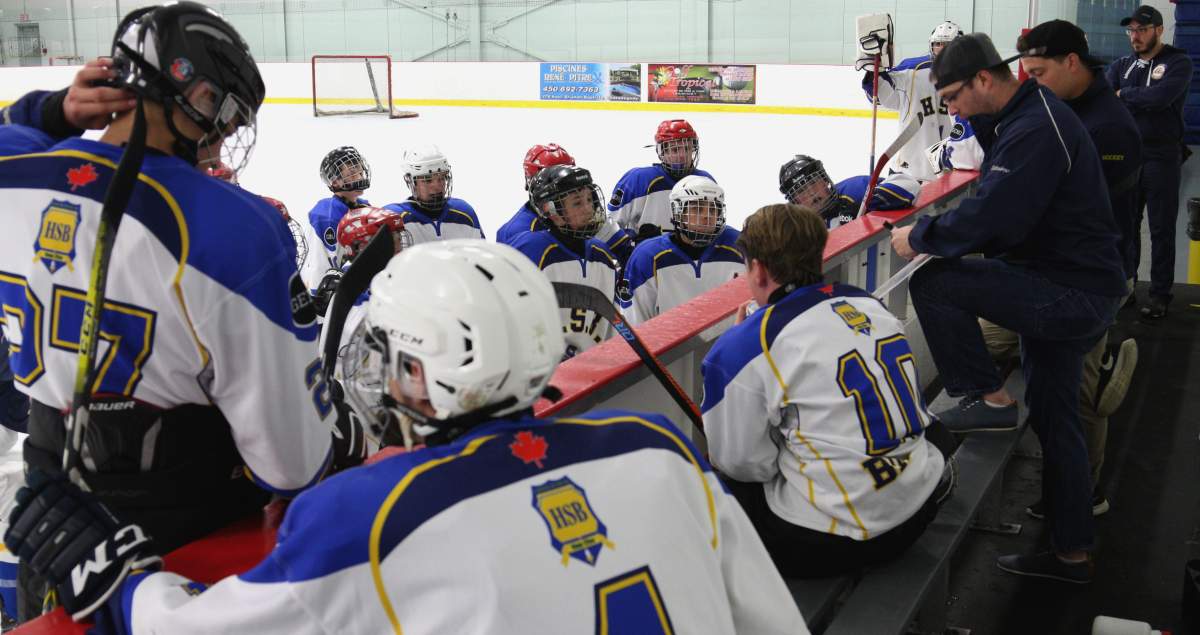 Scott Colosimo coaches the HSB juvenile men's Blazers in an exhibition game during the off-season.