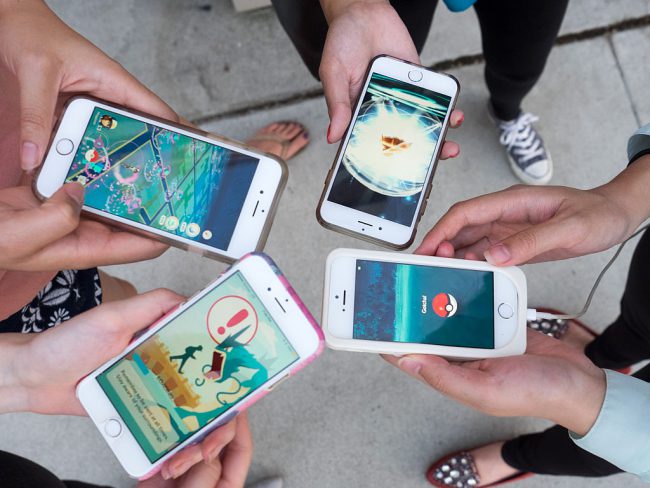 Pokemon Go players are seen in search of Pokemon in Pasadena Playhouse District during PokeNight in Pasadena, California, July 27, 2016.
