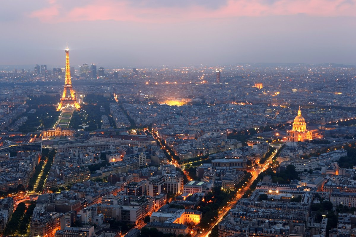General view of Paris at dusk with the Eiffel Tower and the Hotel des Invalides n Paris, France.