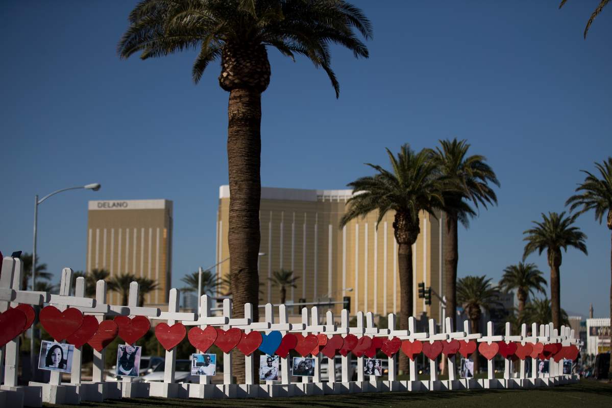 With the Mandalay Bay Resort and Casino in the background (at right), 58 white crosses for the victims of Sunday night’s mass shooting stand on the south end of the Las Vegas Strip, October 5, 2017 in Las Vegas, Nevada.