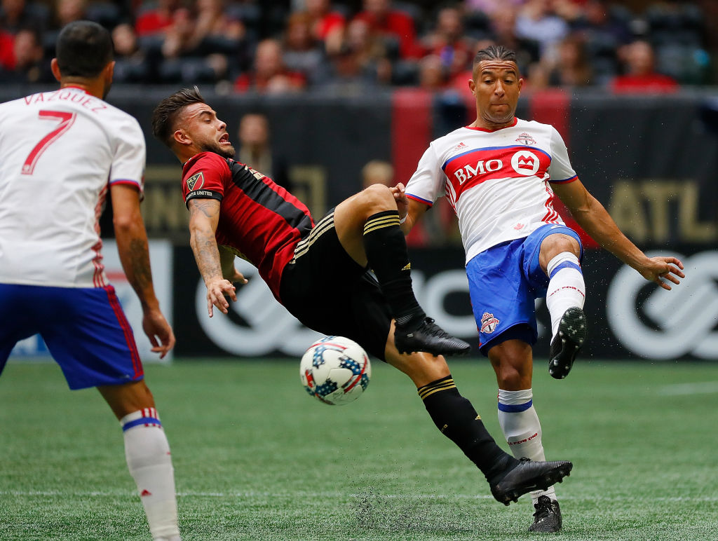 Hector Villalba #15 of Atlanta United challenges Justin Morrow #2 of Toronto FC at Mercedes-Benz Stadium on October 22, 2017 in Atlanta, Georgia. 