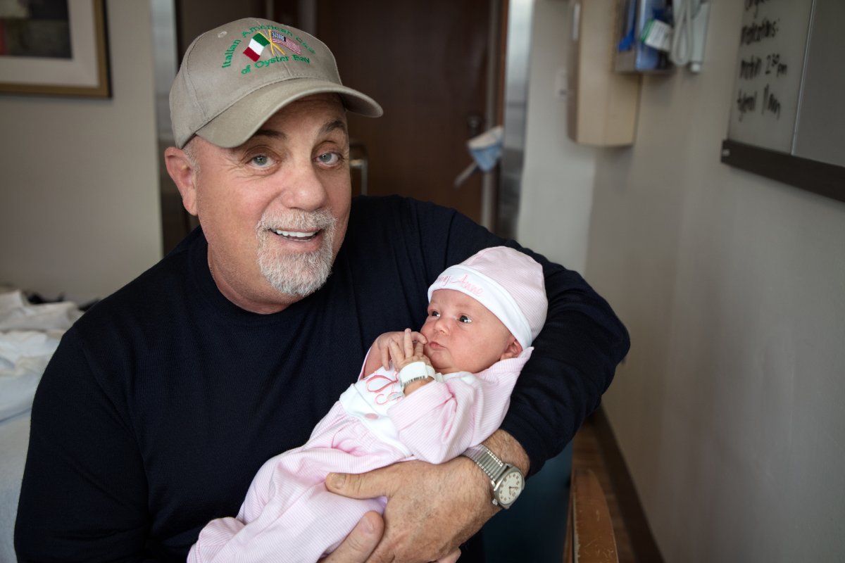 Billy Joel poses with his newbown daughter on October 23, 2017 in New York City.