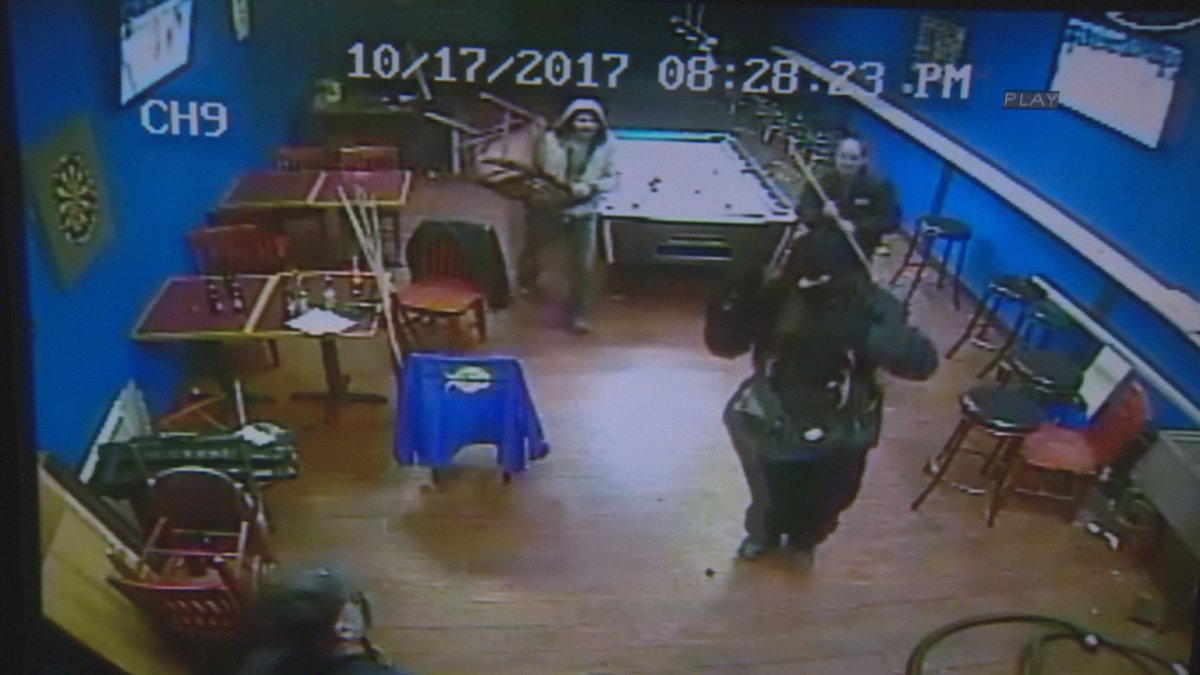 A still taken from surveillance cameras at Gizzys Restaurant and Bar showing patrons and staff fight back against armed suspects. 