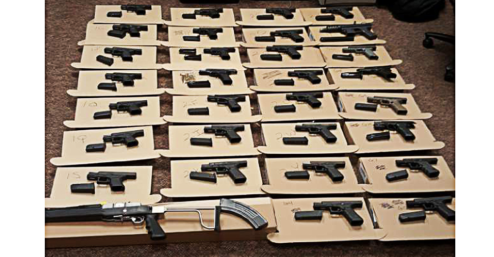 A man was charged with over 330 charges in September after Durham police seized 33 guns and other prohibited devices from a Pickering home.