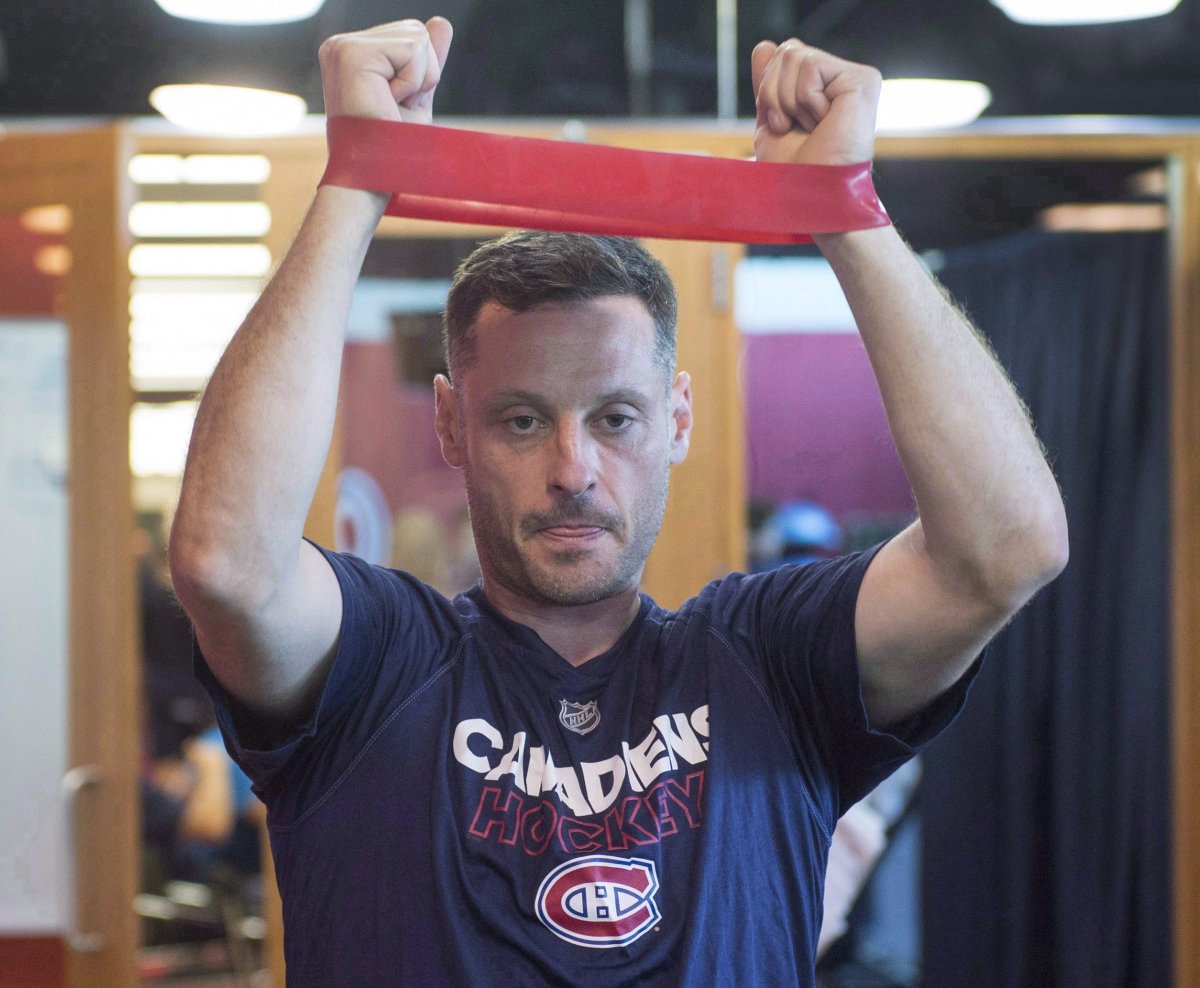 Montreal Canadiens defenceman Mark Streit, from Switzerland, stretches during medical exams on the first day of training camp,  Thursday, September 14, 2017 in Brossard, Que. A person with direct knowledge of the move tells The Associated Press the Canadiens have placed veteran defenceman Streit on waivers. 