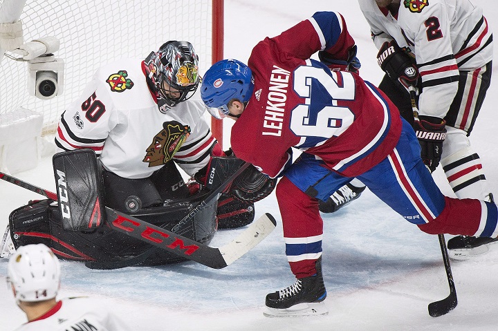 Chicago Blackhawks goalie Corey Crawford makes a save against Montreal Canadiens' Artturi Lehkonen (62) during third period NHL hockey action in Montreal, Tuesday, October 10, 2017.
