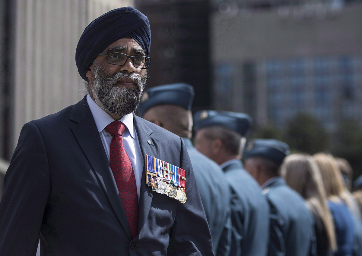 Defence Minister Harjit Sajjan displays his service medals as he leaves a ceremony in which the Royal Canadian Air Force were presented with new ceremonial flags in Toronto on Friday, September 1, 2017. 