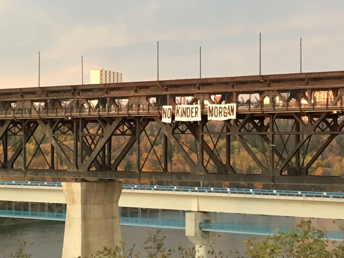 A group of protesters unfurled a 50-foot wide "No Kinder Morgan" banner across Edmonton's High Level bridge Friday morning. September 6, 2017.