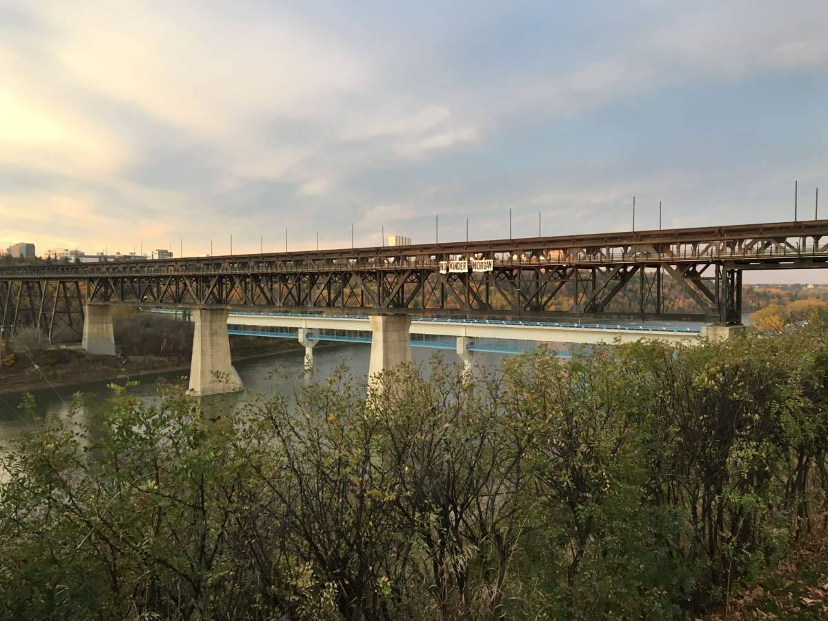 A group of protesters unfurled a 50-foot wide “No Kinder Morgan” banner across Edmonton’s High Level bridge Friday morning. September 6, 2017.