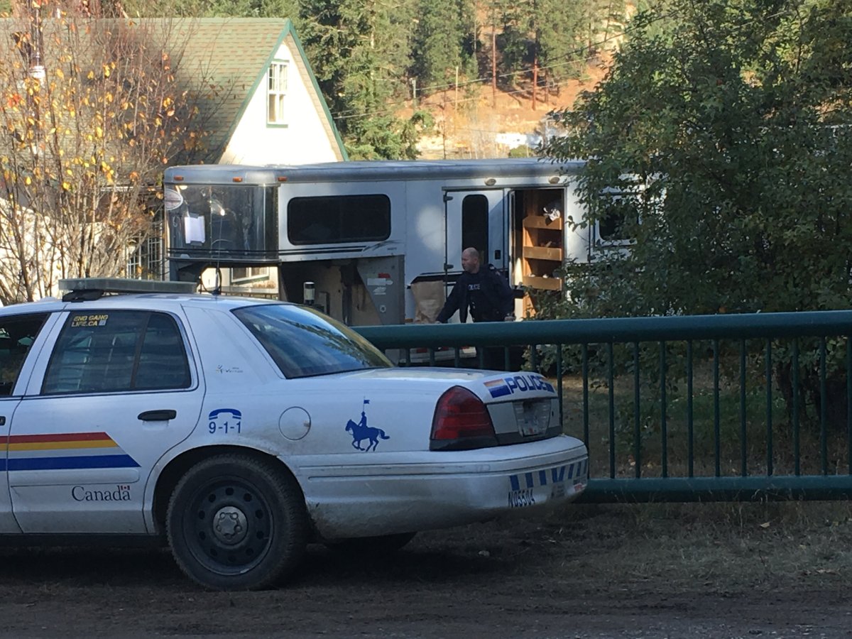 Police search a horse-trailer at a north Okanagan property where human remains have been found.